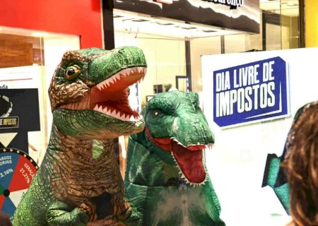 Campanha usa dinossauros para chamar a atenção para a carga tributária em MS